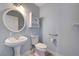 Bathroom featuring a pedestal sink and toilet at 281 Powerbilt Ave, Las Vegas, NV 89148