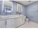 Modern bathroom features dual vessel sinks, sleek white cabinetry, and contemporary lighting at 281 Powerbilt Ave, Las Vegas, NV 89148