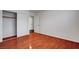 This bedroom features wood floors, neutral walls, and a closet at 281 Powerbilt Ave, Las Vegas, NV 89148