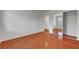 This bedroom features wood floors, neutral walls, and a mirrored closet at 281 Powerbilt Ave, Las Vegas, NV 89148