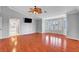 This primary bedroom features wood floors, neutral walls, a ceiling fan, and a bay window at 281 Powerbilt Ave, Las Vegas, NV 89148