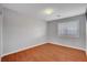 Bright bedroom features wood-look floors and a window with white blinds at 281 Powerbilt Ave, Las Vegas, NV 89148