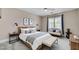 Bedroom features a neutral color palette, stylish furniture, and natural light at 281 Powerbilt Ave, Las Vegas, NV 89148