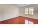 Bedroom features wood floors, neutral paint and window with plantation shutters at 281 Powerbilt Ave, Las Vegas, NV 89148