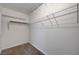 Walk-in closet featuring wire shelving and neutral carpeting at 281 Powerbilt Ave, Las Vegas, NV 89148