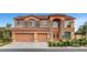 Charming two-story home featuring a three-car garage and attractive stone accents at 281 Powerbilt Ave, Las Vegas, NV 89148