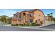 Corner lot home with a three-car garage, lush landscaping, and neutral color scheme at 281 Powerbilt Ave, Las Vegas, NV 89148
