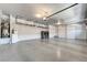 Large garage with laundry, water heater, storage racks, and painted floor at 281 Powerbilt Ave, Las Vegas, NV 89148