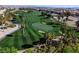 Aerial view of a well-maintained golf course with palm trees in a residential area at 281 Powerbilt Ave, Las Vegas, NV 89148