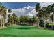 Lush golf course with mature trees, manicured greens, and clear blue skies at 281 Powerbilt Ave, Las Vegas, NV 89148