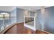 Upstairs hallway with hardwood floors, decorative railing and a chandelier at 281 Powerbilt Ave, Las Vegas, NV 89148