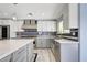 Contemporary kitchen with stainless steel appliances, gray cabinets, and a subway tile backsplash at 281 Powerbilt Ave, Las Vegas, NV 89148