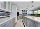 A sleek kitchen with stainless steel appliances, gray cabinets, and ample counter space at 281 Powerbilt Ave, Las Vegas, NV 89148