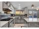 Modern kitchen featuring stainless steel appliances, a backsplash, and a view of the backyard pool at 281 Powerbilt Ave, Las Vegas, NV 89148