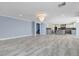 Open-concept living area with sleek tile flooring that seamlessly connects to the kitchen at 281 Powerbilt Ave, Las Vegas, NV 89148