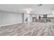 Spacious open concept living area flowing into the kitchen and staircase at 281 Powerbilt Ave, Las Vegas, NV 89148