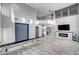 Living room boasting a high ceiling, modern fireplace, and balcony access at 281 Powerbilt Ave, Las Vegas, NV 89148