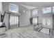 Spacious living room featuring tall ceilings, arched windows, and chandelier at 281 Powerbilt Ave, Las Vegas, NV 89148