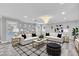 Elegant living room with stylish decor, plush seating, and abundant natural light at 281 Powerbilt Ave, Las Vegas, NV 89148