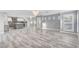 Bright open concept living space flowing into the kitchen with a gray island at 281 Powerbilt Ave, Las Vegas, NV 89148