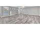 Open living room with shutters and views of the pool at 281 Powerbilt Ave, Las Vegas, NV 89148