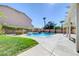 Inviting backyard pool featuring a raised spa and lush landscaping for a private oasis at 281 Powerbilt Ave, Las Vegas, NV 89148