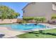 Resort-style pool featuring a waterfall and putting green, ideal for summer relaxation at 281 Powerbilt Ave, Las Vegas, NV 89148