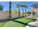 Enjoy the backyard putting green, perfect for golf enthusiasts and outdoor recreation at 281 Powerbilt Ave, Las Vegas, NV 89148
