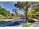 Scenic street lined with mature trees, manicured lawns, and well-maintained sidewalks in a residential area at 281 Powerbilt Ave, Las Vegas, NV 89148