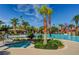 Beautiful community pool area featuring palm trees, a jacuzzi and fun water features in the distance at 281 Powerbilt Ave, Las Vegas, NV 89148