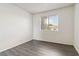 This bedroom features a window, wood flooring, and plenty of space at 3151 Soaring Gulls Dr # 2081, Las Vegas, NV 89128