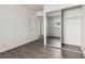 This bedroom features closet space, wood flooring, and a window with a view of the outside at 3151 Soaring Gulls Dr # 2081, Las Vegas, NV 89128