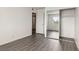 This bedroom has wood floors, a closet, and a window with a view of the outside at 3151 Soaring Gulls Dr # 2081, Las Vegas, NV 89128