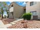 Exterior access to condo unit featuring stairs, a small balcony and rock landscaping at 3151 Soaring Gulls Dr # 2081, Las Vegas, NV 89128