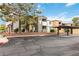 Exterior view of the condo featuring assigned covered parking with well-maintained grounds and landscaping at 3151 Soaring Gulls Dr # 2081, Las Vegas, NV 89128