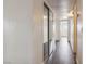 The hallway has hardwood floors, with access to closet space and rooms with a view of the outside at 3151 Soaring Gulls Dr # 2081, Las Vegas, NV 89128