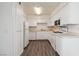 This home has an all white kitchen with updated appliances and fixtures at 3151 Soaring Gulls Dr # 2081, Las Vegas, NV 89128