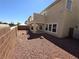 A view of the home's backyard featuring rock landscaping at 32 Focal Point Ave, North Las Vegas, NV 89031