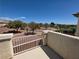Balcony view overlooking well maintained landscaping, offering a serene and picturesque setting for outdoor enjoyment at 32 Focal Point Ave, North Las Vegas, NV 89031
