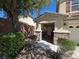 Charming covered front porch with stone accents, offering a welcoming entrance at 32 Focal Point Ave, North Las Vegas, NV 89031