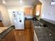 Functional kitchen featuring a white refrigerator and laminate countertops, perfect for everyday cooking needs at 32 Focal Point Ave, North Las Vegas, NV 89031