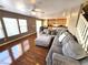 Spacious living room with hardwood flooring, flowing into dining and kitchen areas at 32 Focal Point Ave, North Las Vegas, NV 89031