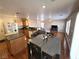 Spacious living room with wooden floors, kitchen and dining area in view, creating an open concept at 32 Focal Point Ave, North Las Vegas, NV 89031