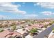 Panoramic view captures a row of houses in a neighborhood with a clear road nearby and mountain views at 3913 Ricebird Way, North Las Vegas, NV 89084