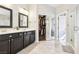 Modern bathroom features a double vanity, and a large closet at 3913 Ricebird Way, North Las Vegas, NV 89084