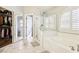 Modern bathroom features a shower, a large closet and an oval tub at 3913 Ricebird Way, North Las Vegas, NV 89084