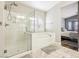 Bathroom features a shower, an oval tub and natural light from a window at 3913 Ricebird Way, North Las Vegas, NV 89084
