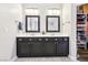 Modern bathroom features a double vanity, and a large closet at 3913 Ricebird Way, North Las Vegas, NV 89084