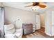 Bright Bedroom features a plush chair and a changing table at 3913 Ricebird Way, North Las Vegas, NV 89084