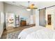 Bright bedroom features a wooden fan, a gray rug and a sliding barn door at 3913 Ricebird Way, North Las Vegas, NV 89084